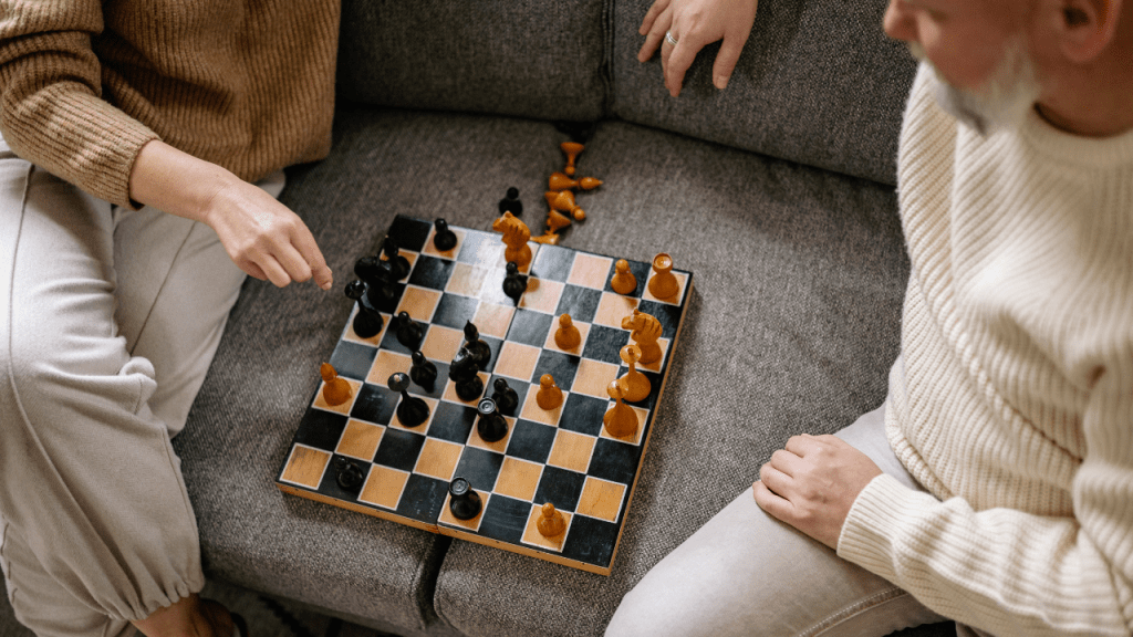 A chess board representing the strategic decision-making involved in choosing COBRA alternatives and managing health insurance costs during a job transition